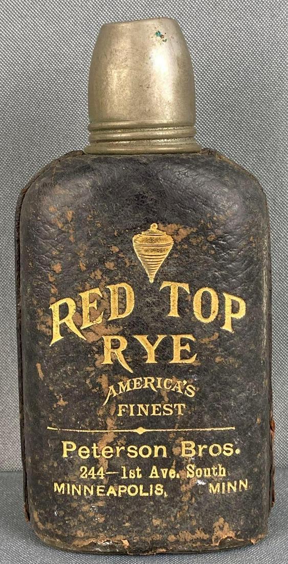 Vintage Red Top Rye Advertising Bottle: Leather wrapped bottle, Peterson Bros., Minneapolis, MN, bottom of wrap fallen off, measures 6x3x1 1/2in.