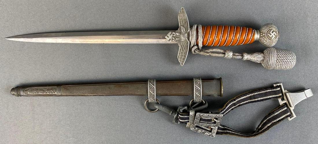 WW2 German Lutwwaffe Dress Knife and Scabbard: WKC Solingen stamped on blade, ornate handle and sheath, measures 15 1/4in long.