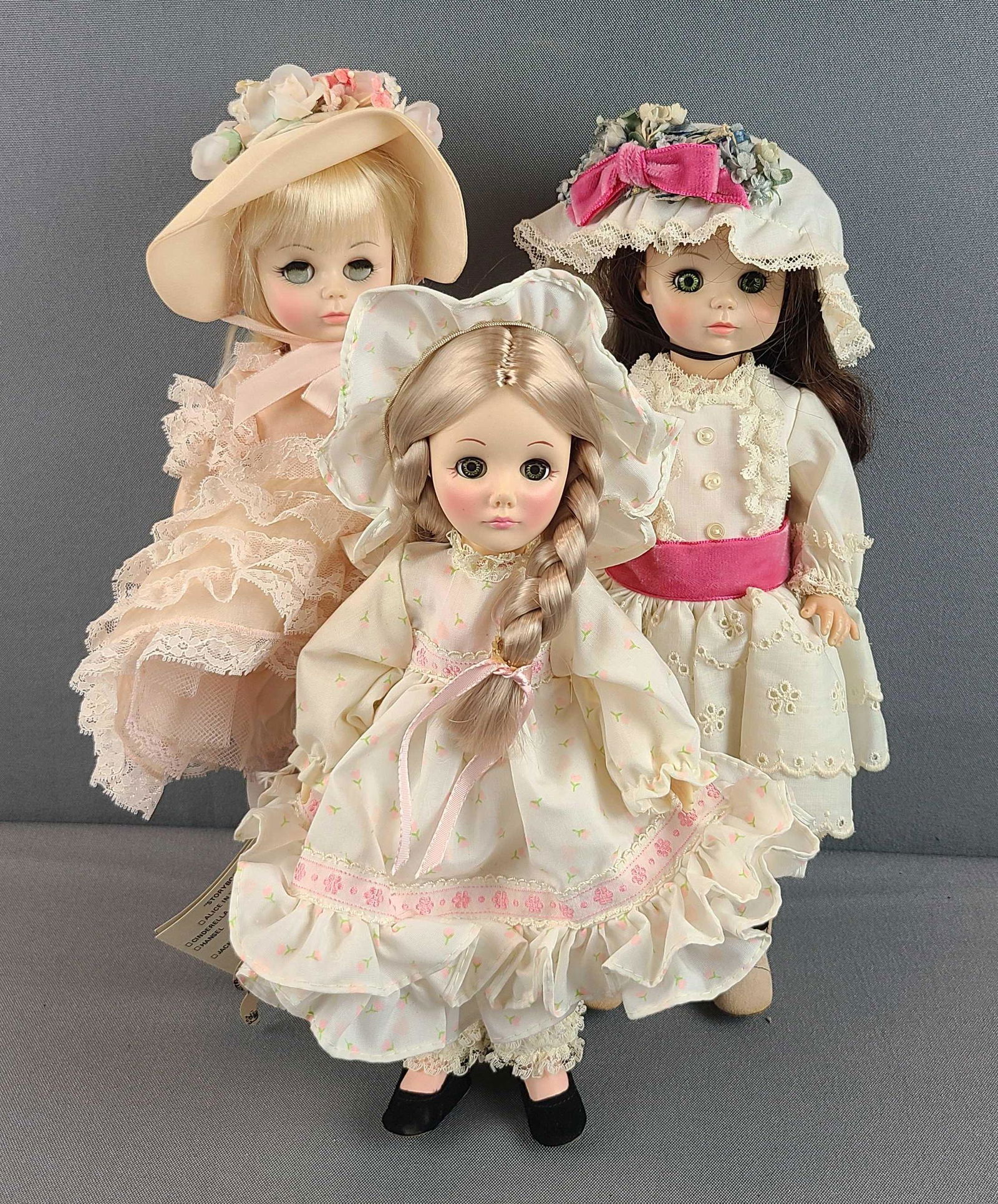Group of 3 dolls: 2 Madame Alexander, Effanbee. 1 has cloudy eyes. Larger dolls are 13 inches