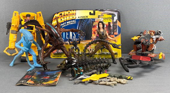 Group of Assorted Aliens Action Figures and More: Includes Ripley in power loader, Xenomorphs, Predator, firearms, and more, Action Masters die-cast packaging measures 8 x 11 x 1 1/2in.