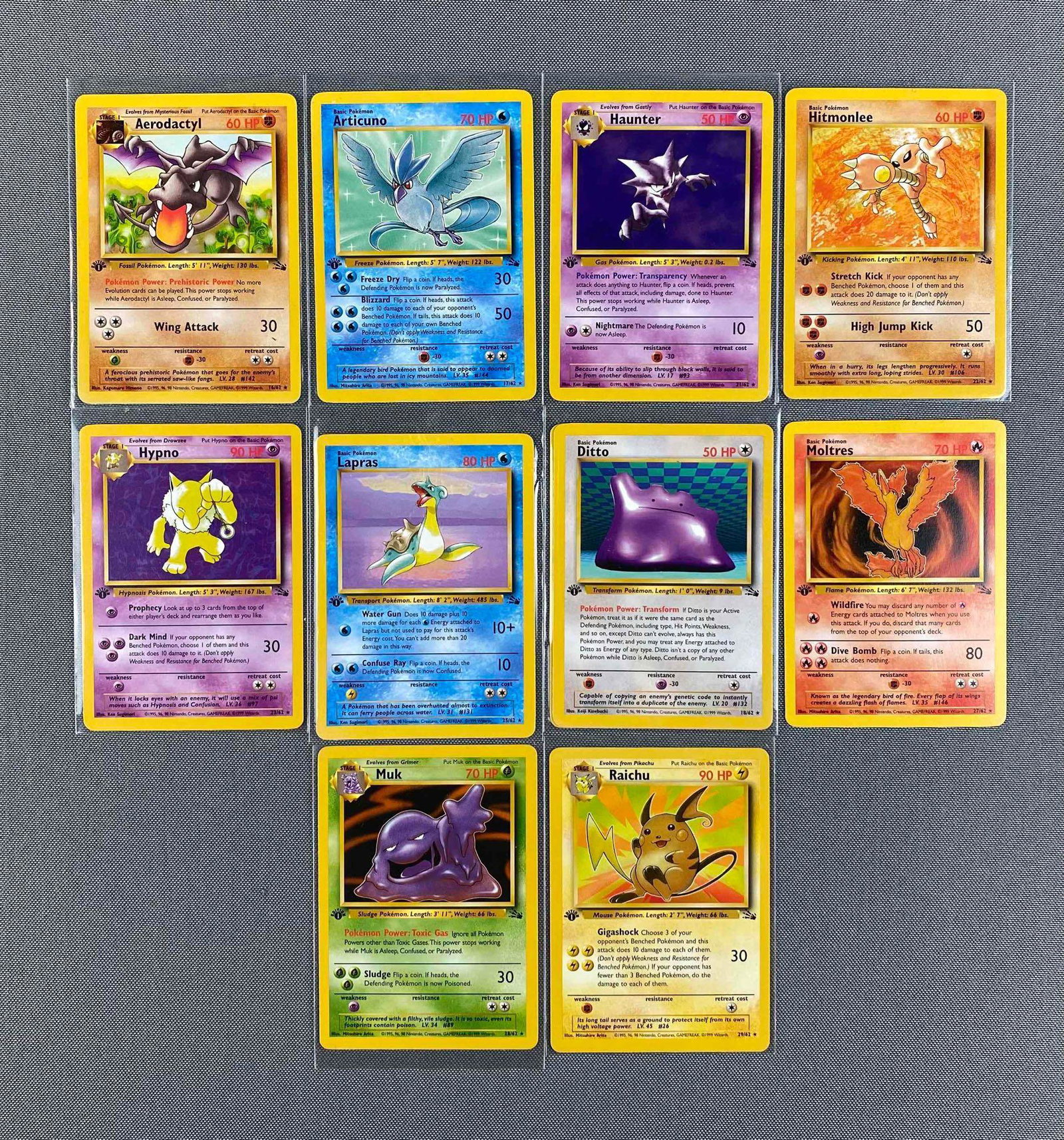 Group of 10 1999 Pokemon Fossil Set 1st Edition Cards: #16 Aerodactyl, #22 Hitmonlee, #23 Hypno, #29 Raichu, and more