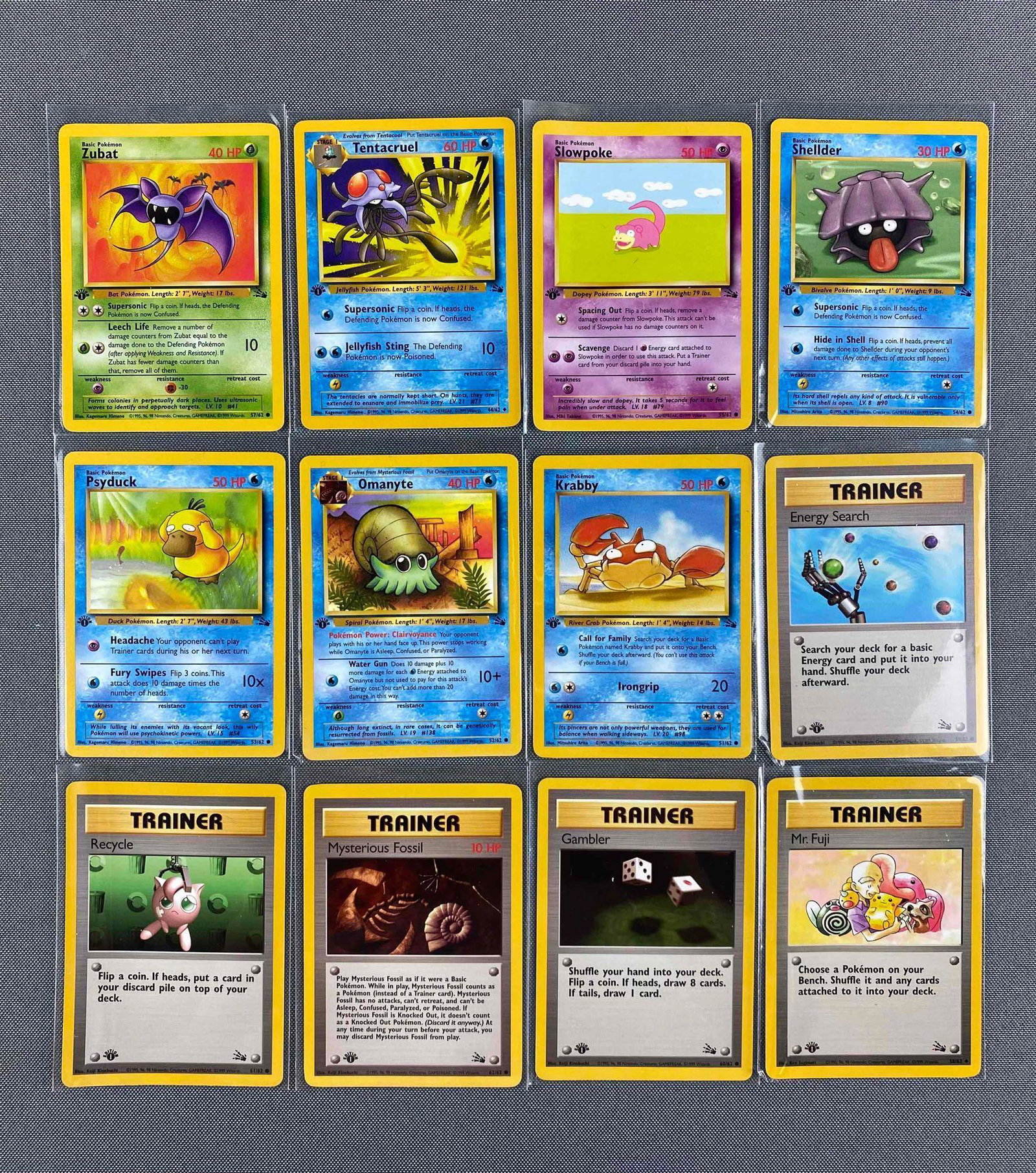 Group of 12 Pokemon Fossil Set 1st Edition Cards: #55 Slowpoke, #53 Psyduck, #51 Krabby, #54 Shellder and more