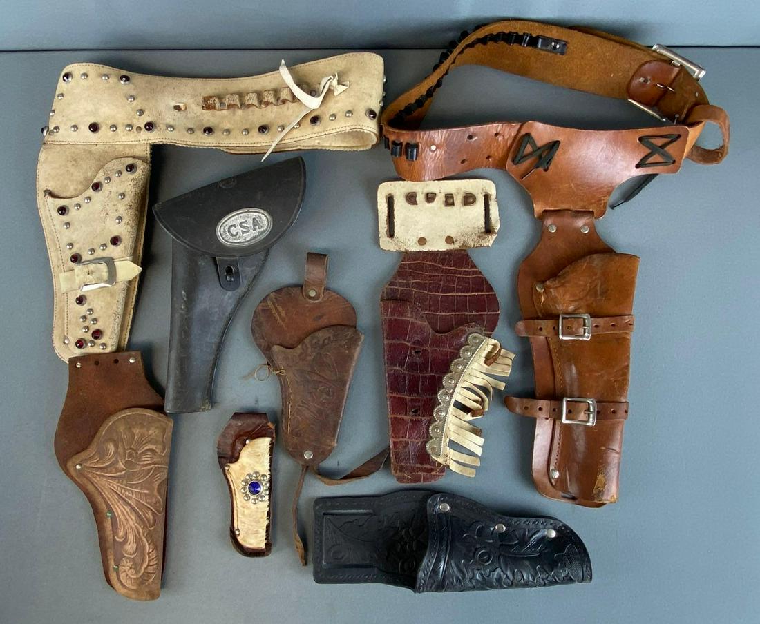 Group of 8 Vintage Cap Gun Holsters: 1950s-60s, all with some wear, sow with belts, largest holster measures 11 x 4 1/2in.