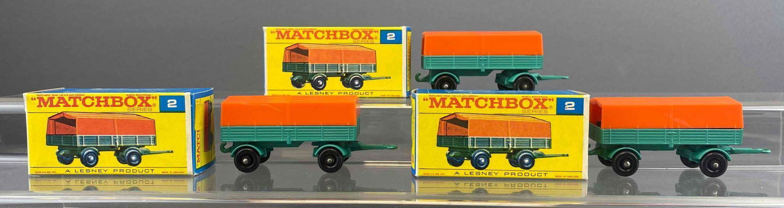 Group of 3 Matchbox No. 2 Mercedes Trailer: Blue/Orange. A Lesney Product. Black plastic wheels. Original box. Made in England. Die-cast.