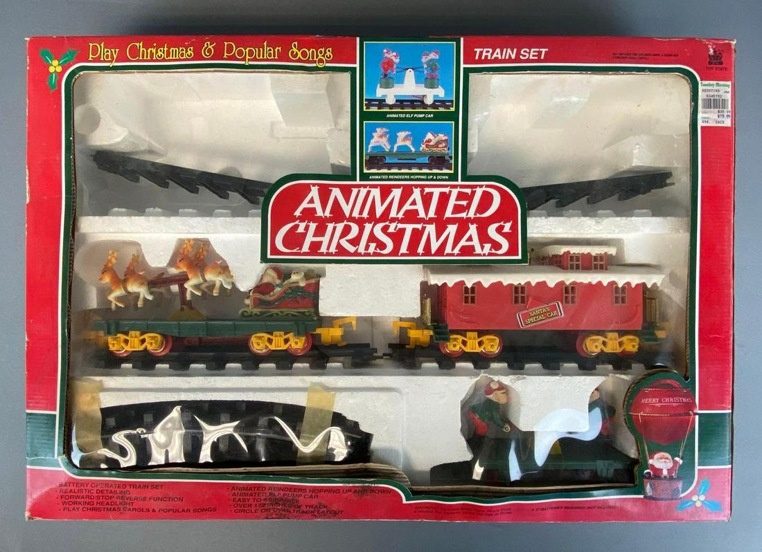 Toy State Animated Christmas Train Set: 1993, O Scale, some missing pieces, untested, in original box, box with tears and water damage, box measures 17 1/4 x 25 x 4 1/4in.