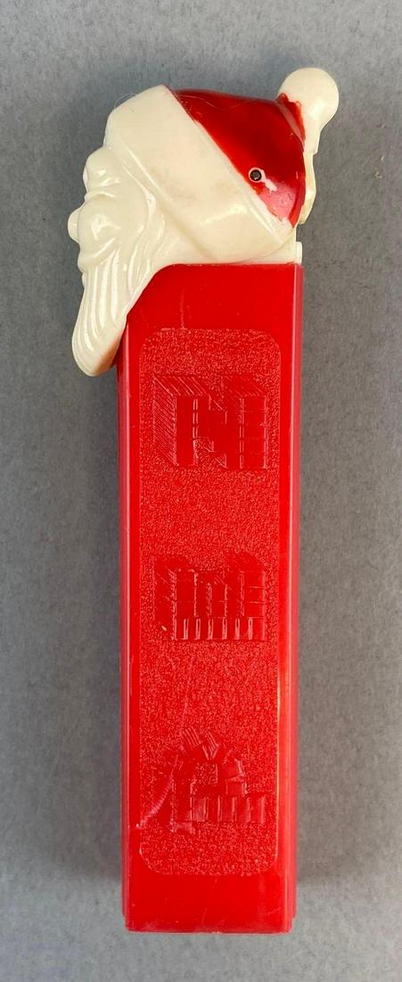 Santa Calus Footless PEZ Dispenser: 3 3/4 x 3/4 inches.