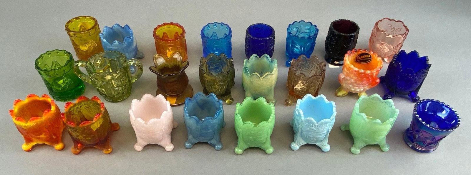 Group of 20+ Assorted Glass Toothpick Holders: Includes cobalt glass, uranium, amber, and more. Some marked old sleepy eye.