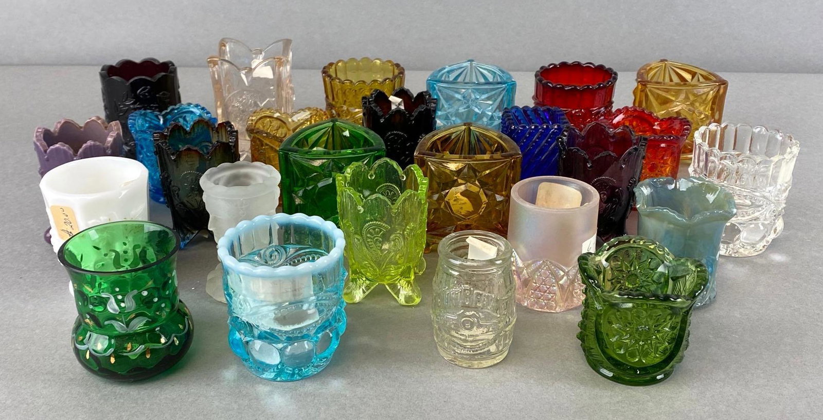 Group of 20+ Assorted Glass Toothpick Holders: Includes Jim Beam barrel, uranium glass, cut glass, green glass, satin glass, and more, tallest measures 3 x 2 x 2in.