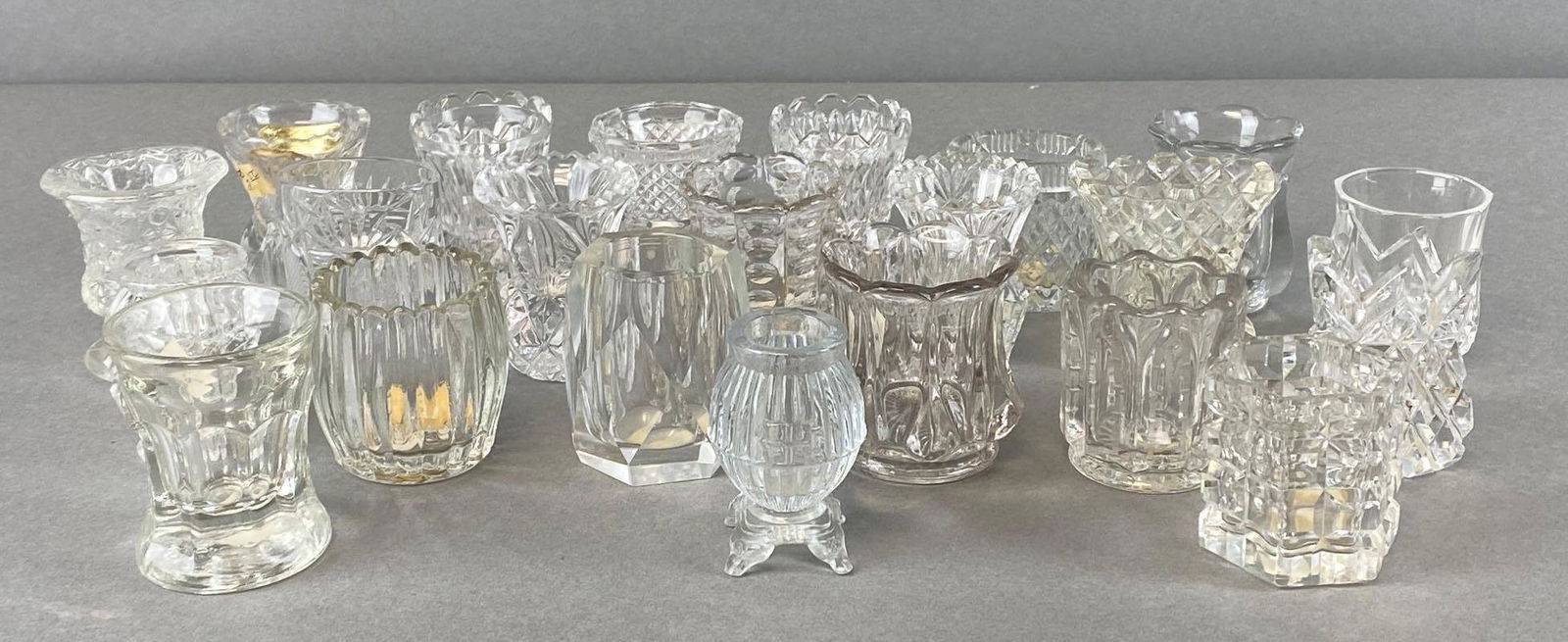 Group of 20+ Assorted Cut Glass Toothpick Holders: Tallest measures 2 1/2 x 2 x 2in.