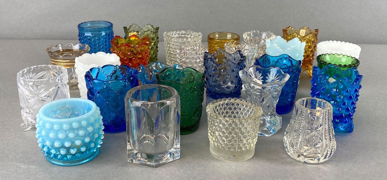 Group of 20+ Assorted Glass Toothpick Holders: Includes hobnail glass, ombre, cobalt, cut glass, etched glass, and more, tallest measures 3 x 2 x 2in.