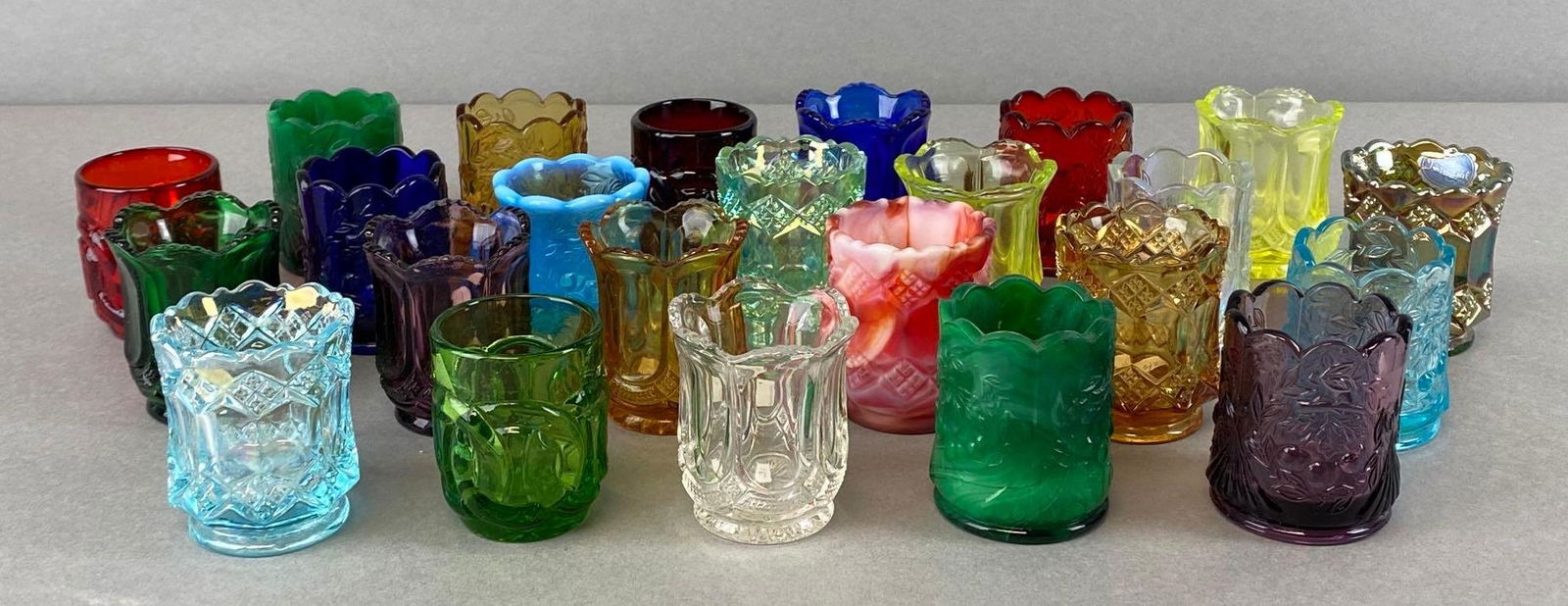 Group of 20+ Assorted Glass Toothpick Holders: Includes uranium glass, green glass, cobalt glass, Amber glass, and more, tallest measures 2 1/2 x 2 x 2in.