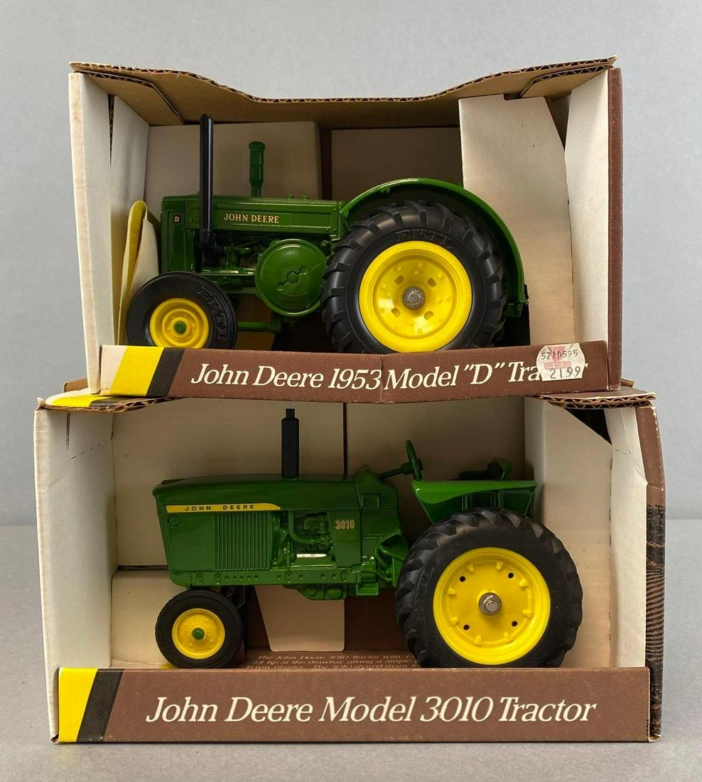 Group of 2 ERTL John Deere Die Cast Tractors: 1/16 scale, includes 1960 Model 3010 Tractor, 1953 Model D Tractor, both in original boxes, largest box measures 6 1/4 x 10 3/4 x 6in.