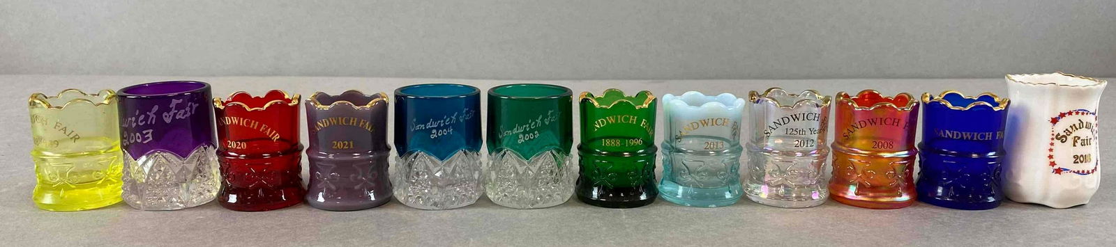 Group of Sandwich Fair Toothpick Holders: 21/2, 12 shot glasses, various designs and Years