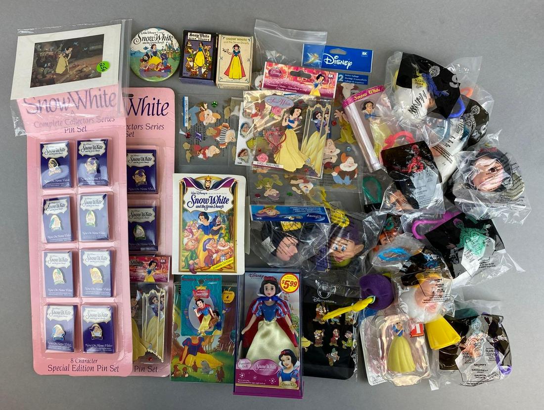 Group of Assorted Disney Snow White and the Seven Dwarfs Items: Includes pins, keychains, figures, and more. Largest measures 16 x 6 inches. Majority sealed.