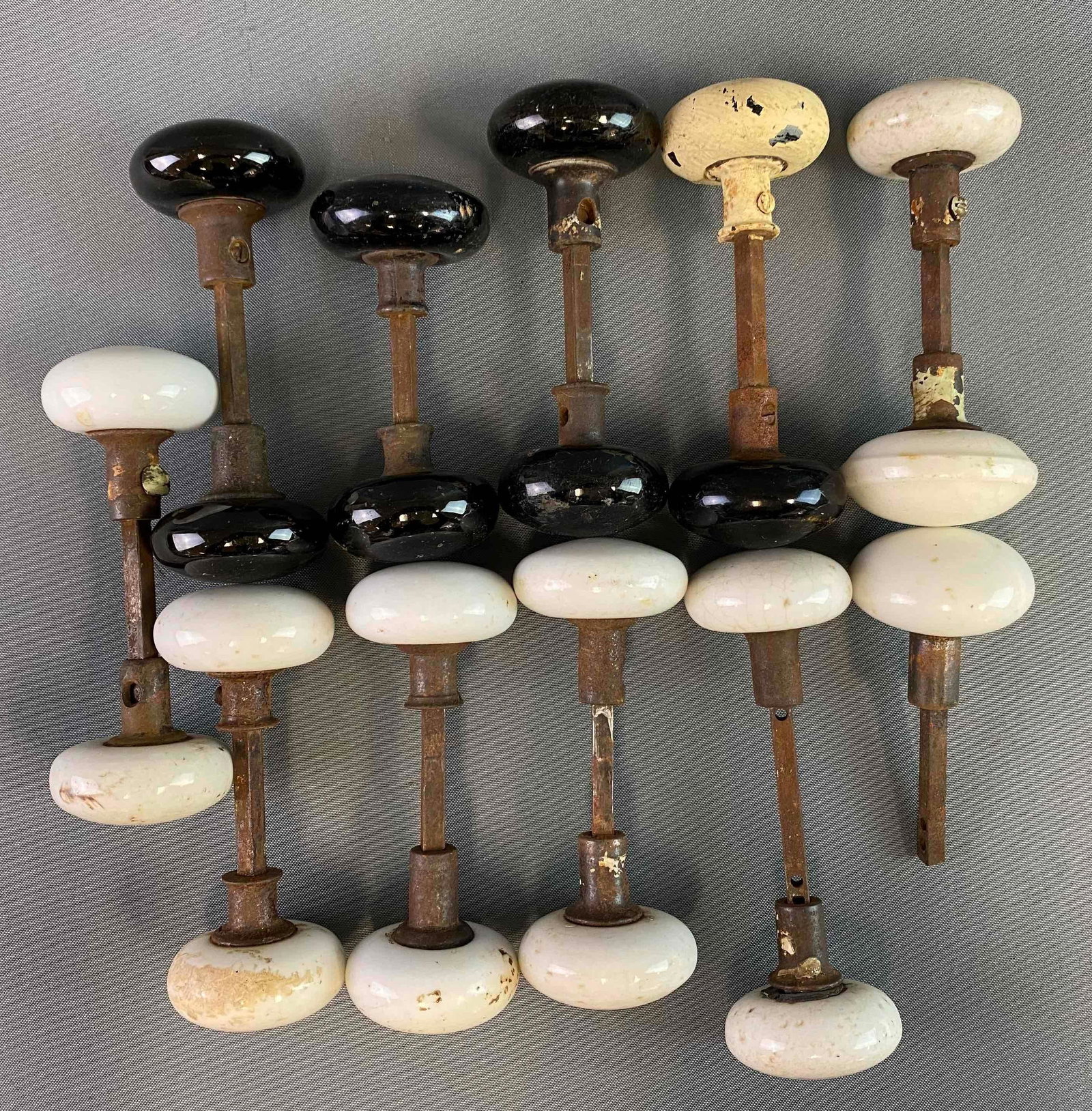 Group of 11 Porcelain Door Knobs: White and black Knobs