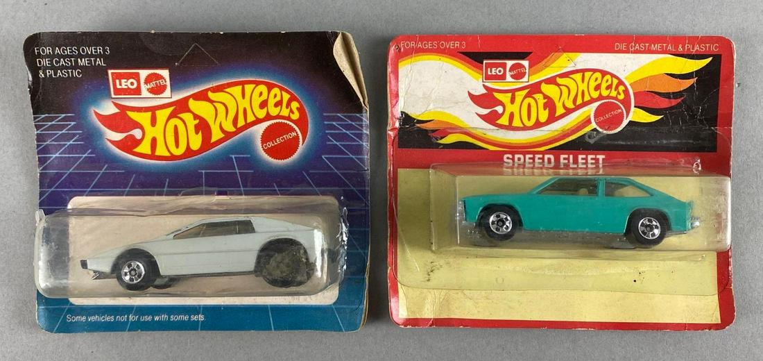 Group of 2 Leo Mattel Hot Wheels Die-Cast Vehicles: Includes Royal Flash, and Chevy Citation. In original packaging. Both with torn packaging. Largest packaging measures 4 x 4 1/2 x 1 1/2in. Made in India