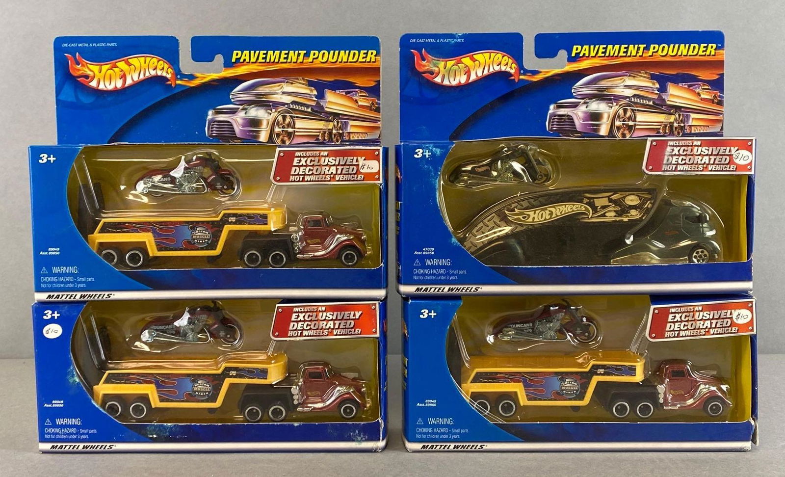 Group of 4 Hot Wheels Pavement Pounder Die-Cast Vehicles: Mattel. In original packaging. Packaging measures 7 x 9 x 2in.