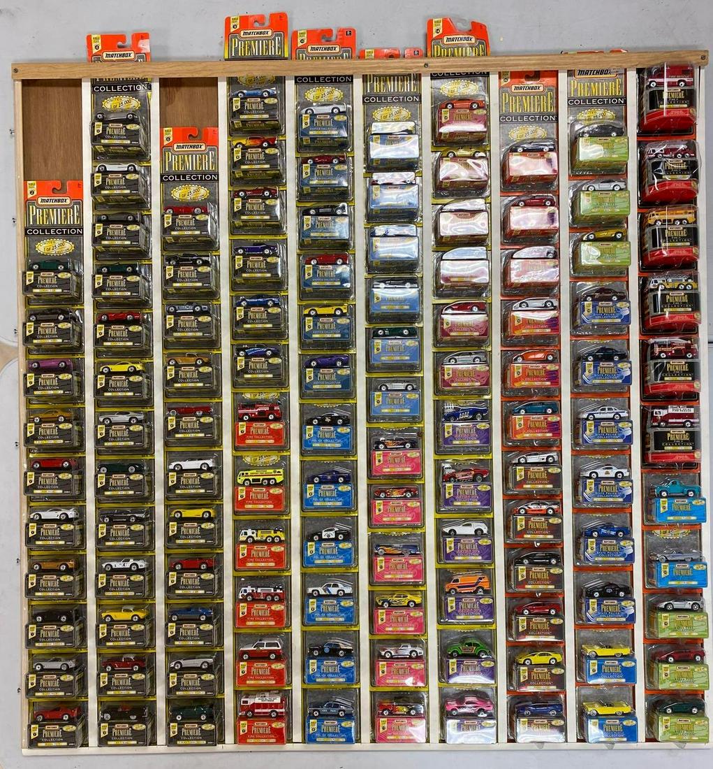Group of 116 Matchbox Premiere die-cast vehicles: New in original packaging, includes Retro 70s, Hot Rod, Street Machines, and more. Mounted for display-appx 45x2.5x47.75 inches. Can be shipped without display