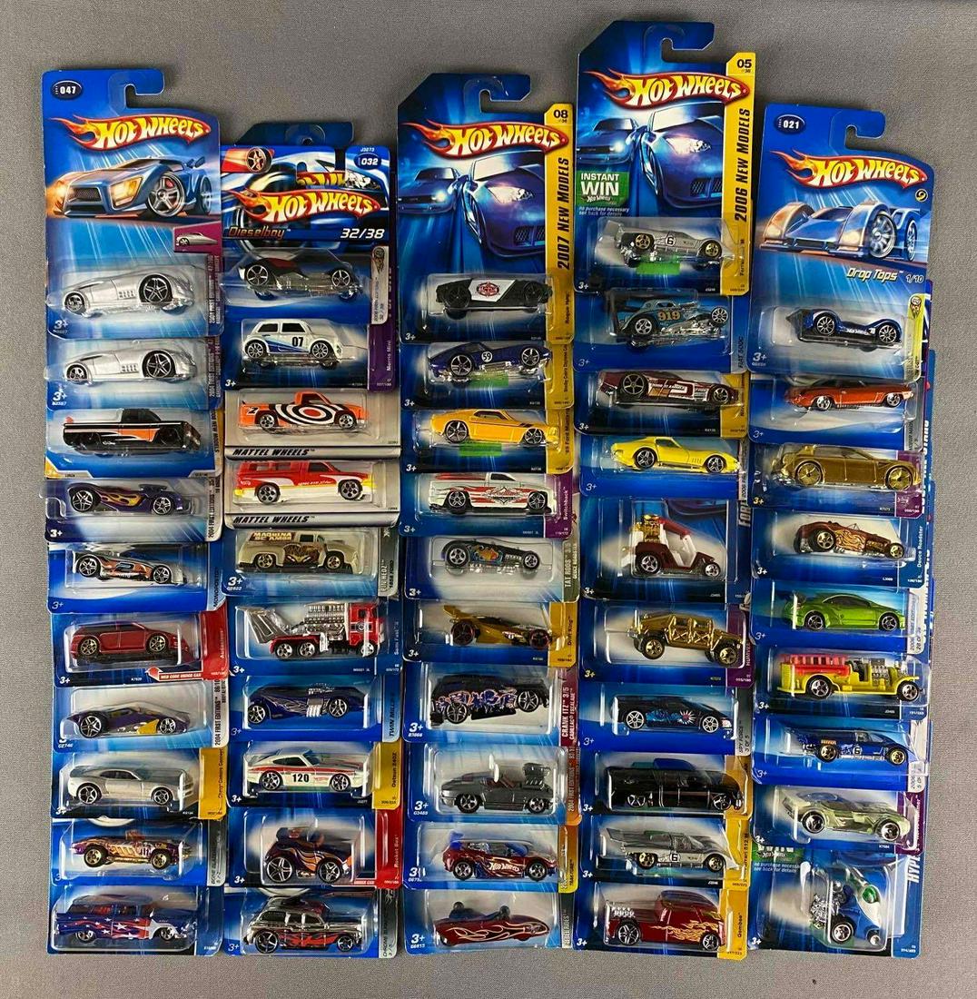 Group of 40+ Assorted Hot Wheels Die-Cast Vehicles: Includes Crack itz, spy force, Qombee and more, like new in original packaging