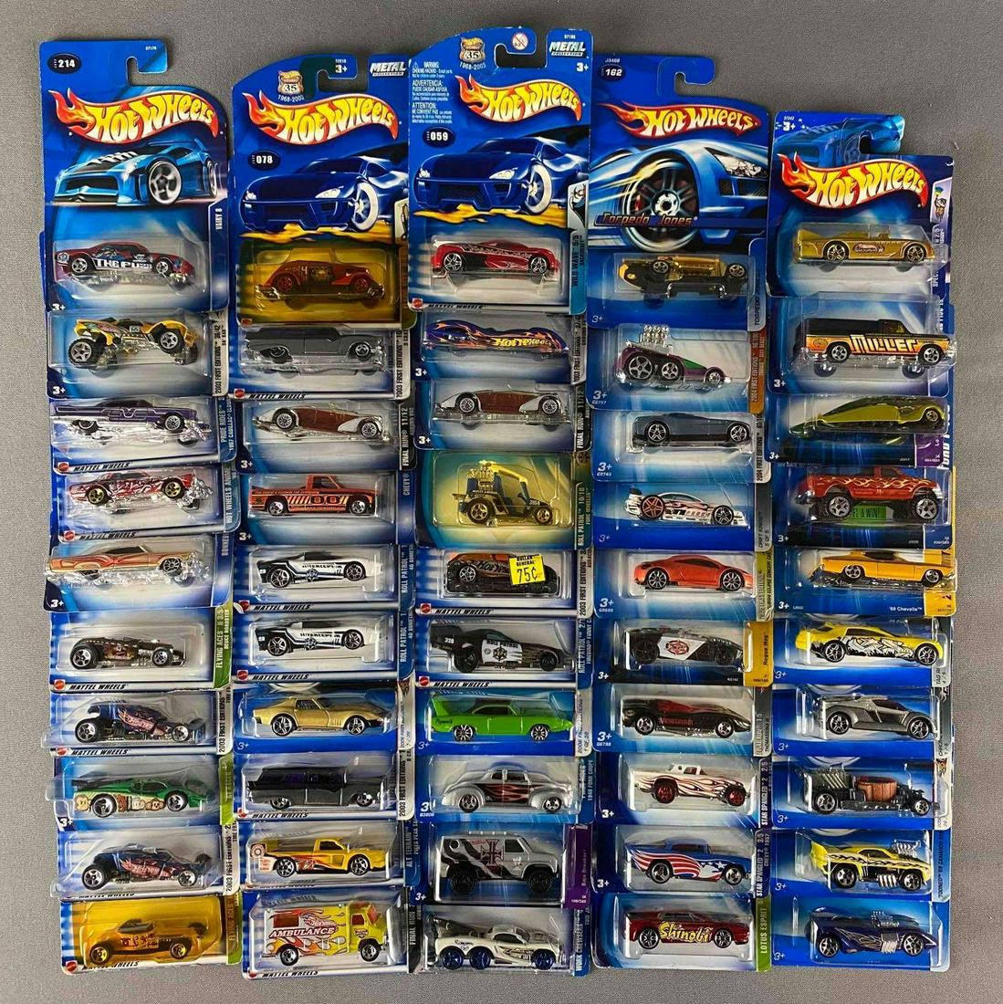 Group of 40 Assorted Hot Wheels Die-Cast Vehicles: Includes Roll patrol, Tow jam, flying Aces and more, like new in original packaging, some sun damage