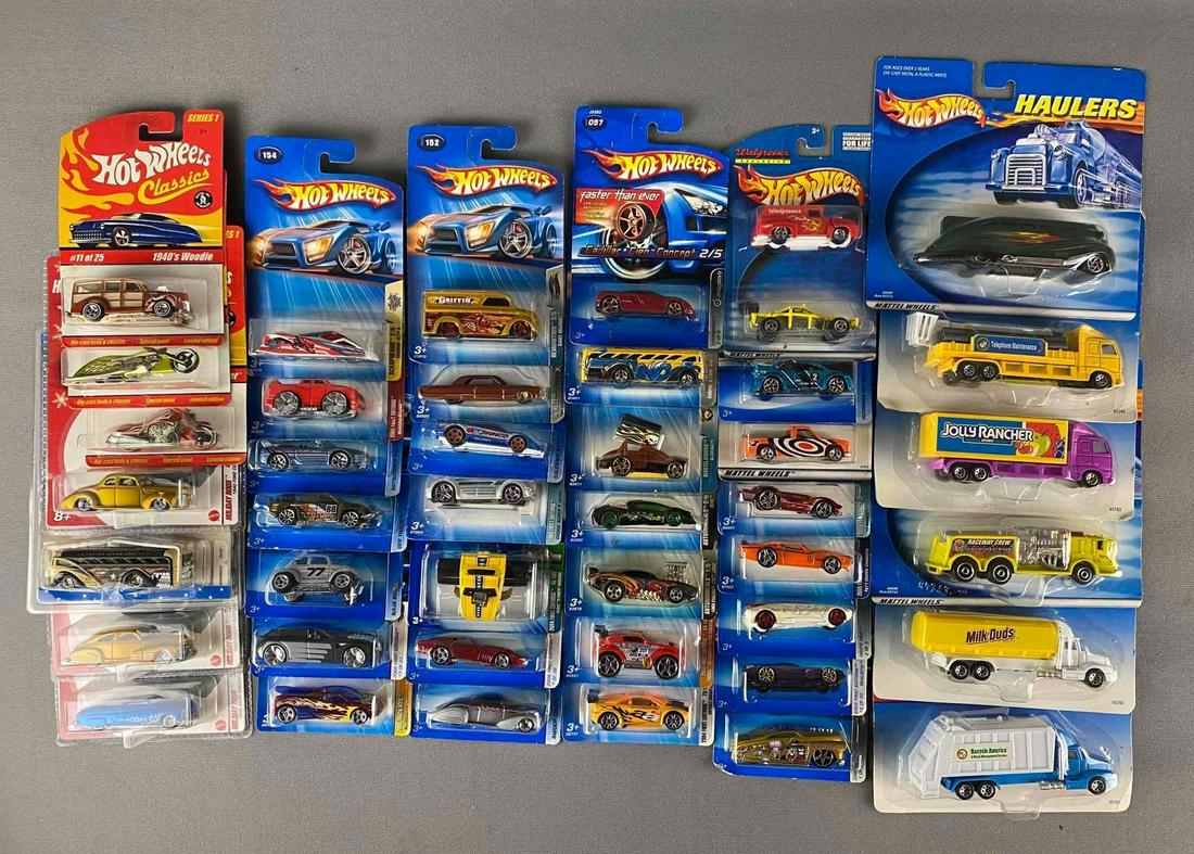 Group of 40+ Assorted Hot Wheels Die-Cast Vehicles: Includes 1940 woodie, Cadillac cien concept and more, like new in original packaging,