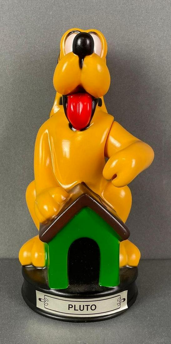 Disney Pluto Plastic Bank: arm moves and holds coin. measures 9 x 4 1/2 x 4 1/2 inches