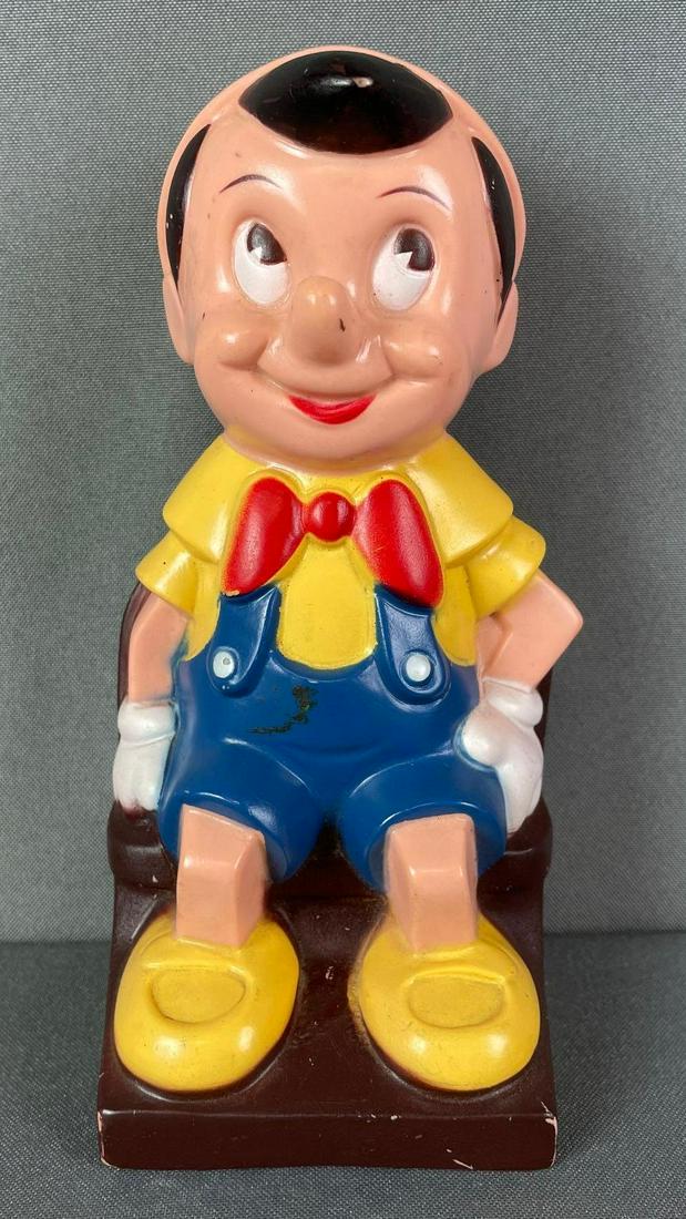 Vintage Disney Pinocchio Plastic Bank: play pal plastics. sticker on back. item measures 8 x 4 x 3 inches