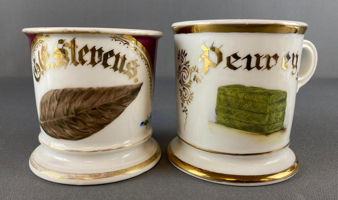 Group of 2 Antique Occupational Shaving Mugs: includes Tobacco leaf and Hay Bale, G.E. Stevens, Peuney, Koken Barbar supply Co. St. Louis, V and D Austria. measures 3 1/2 x 4 5/8 x 3 3/8