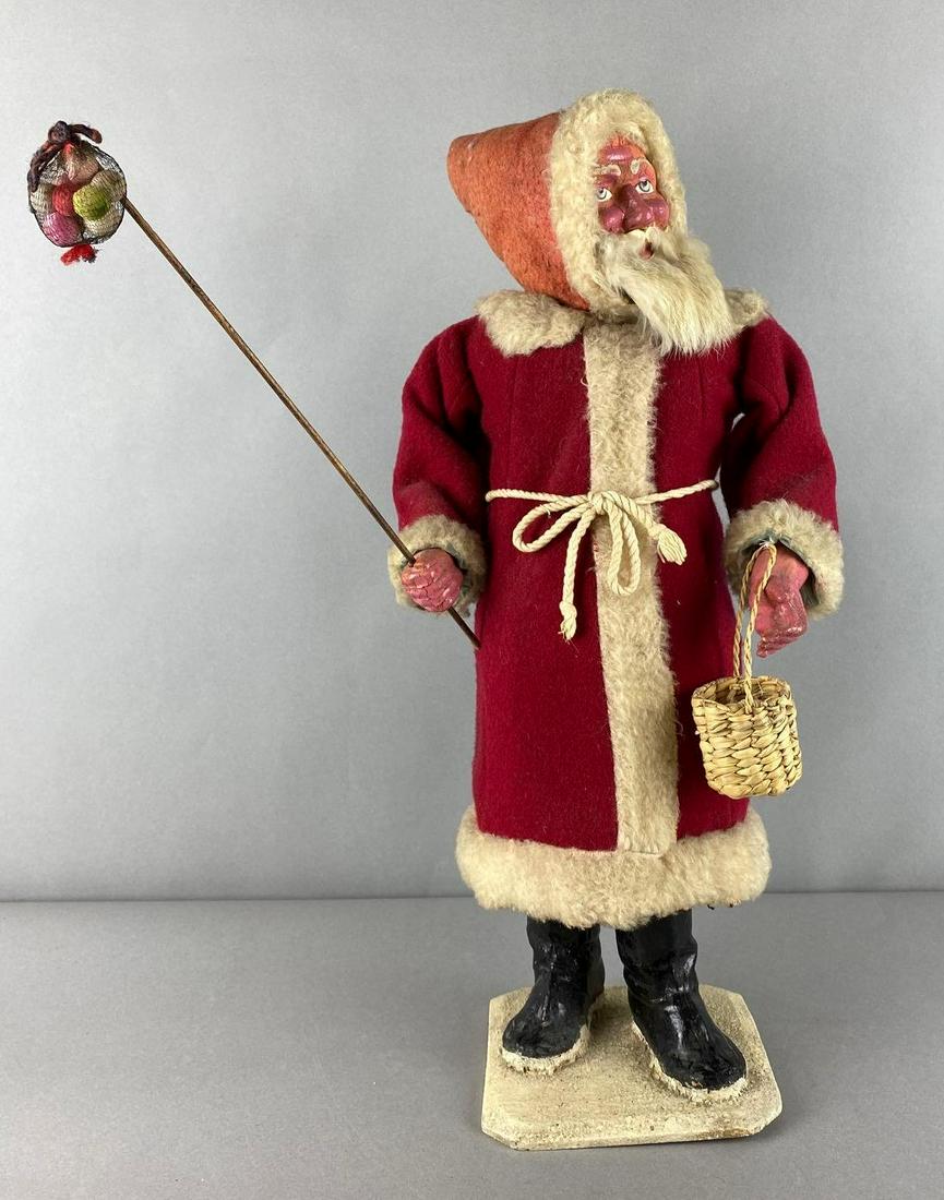 Vintage Santa Claus Wind Up Nodder Figure: Includes Original Wind Key, The mechanism is in working condition but the head does not move. Brackets may need to be tinkered with to work properly. cracking and crazing, moth holes in coat, measures