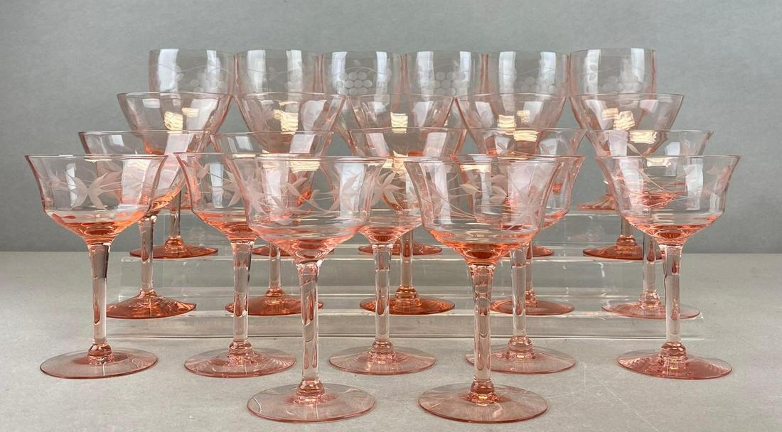 Group of 23 Pink Depression Stemmed Glasses: 4 designs. Largest measures 5 3/4 x 3 inches