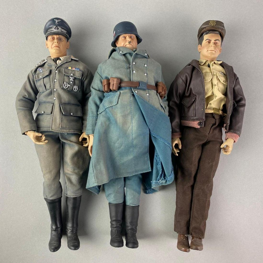 Group of 3 Hogans Heros Action Figures: Includes Sgt. Hans Georg Schultz, Col. Robert E Hogan, and Col. Wilhelm Klink. Largest measures 12 1/2 inches long.