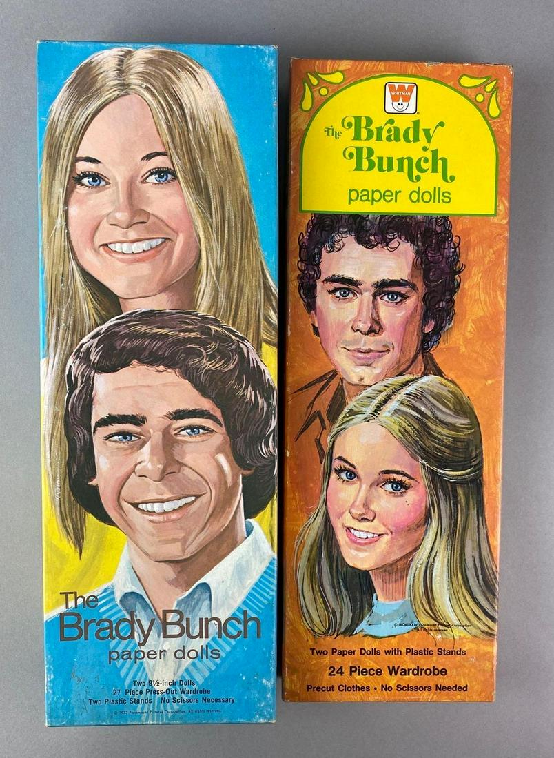 Group of 2 The Brady Bunch Paper Dolls: Sets appear complete. Largest packaging measures 14 1/2 x 5 x 2 inches