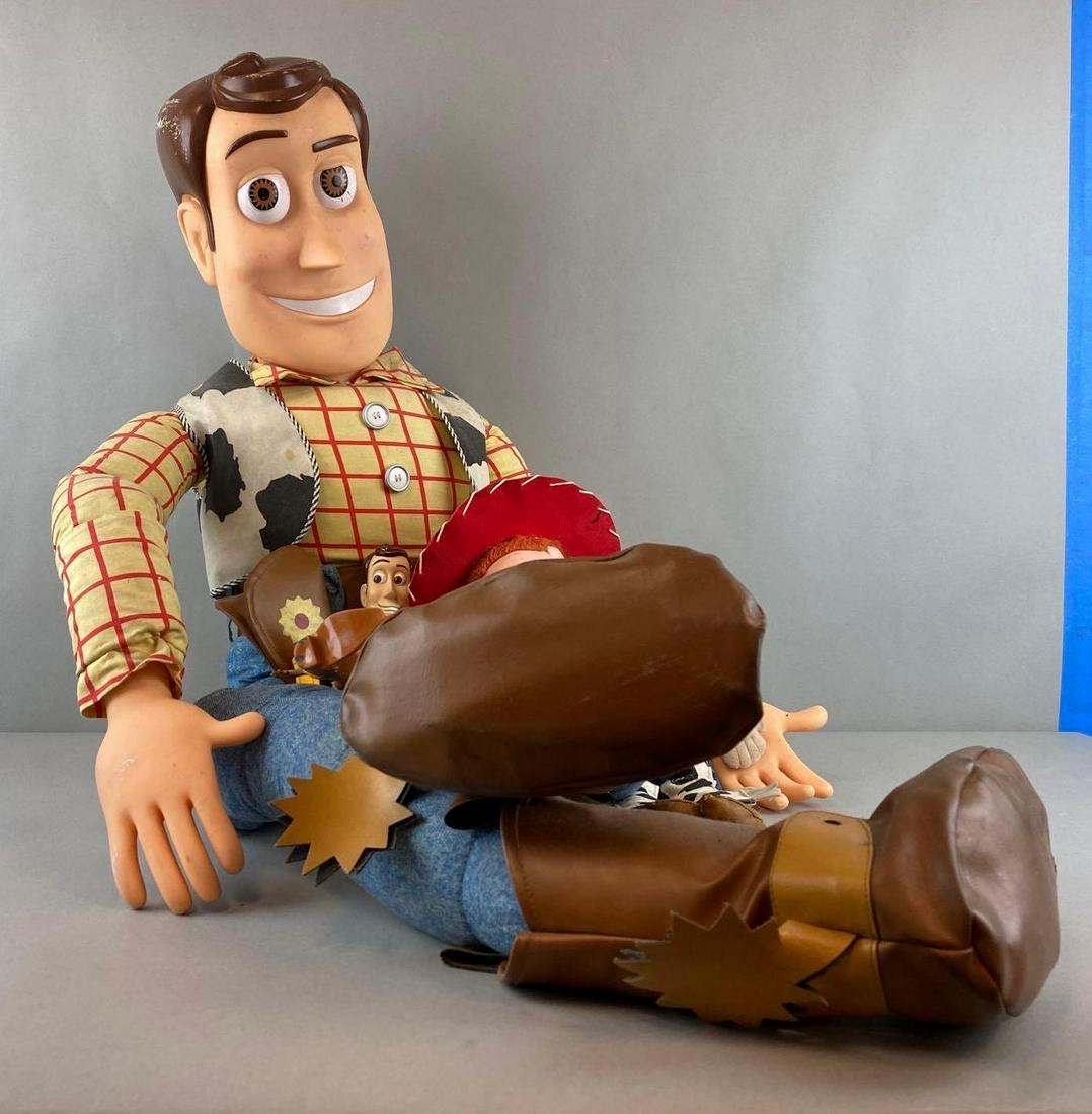 Group of 3 Toy Story Toys: Includes Jesse, and two Woody. One woody is very large/head is scuffed. Largest measures 50 inches long