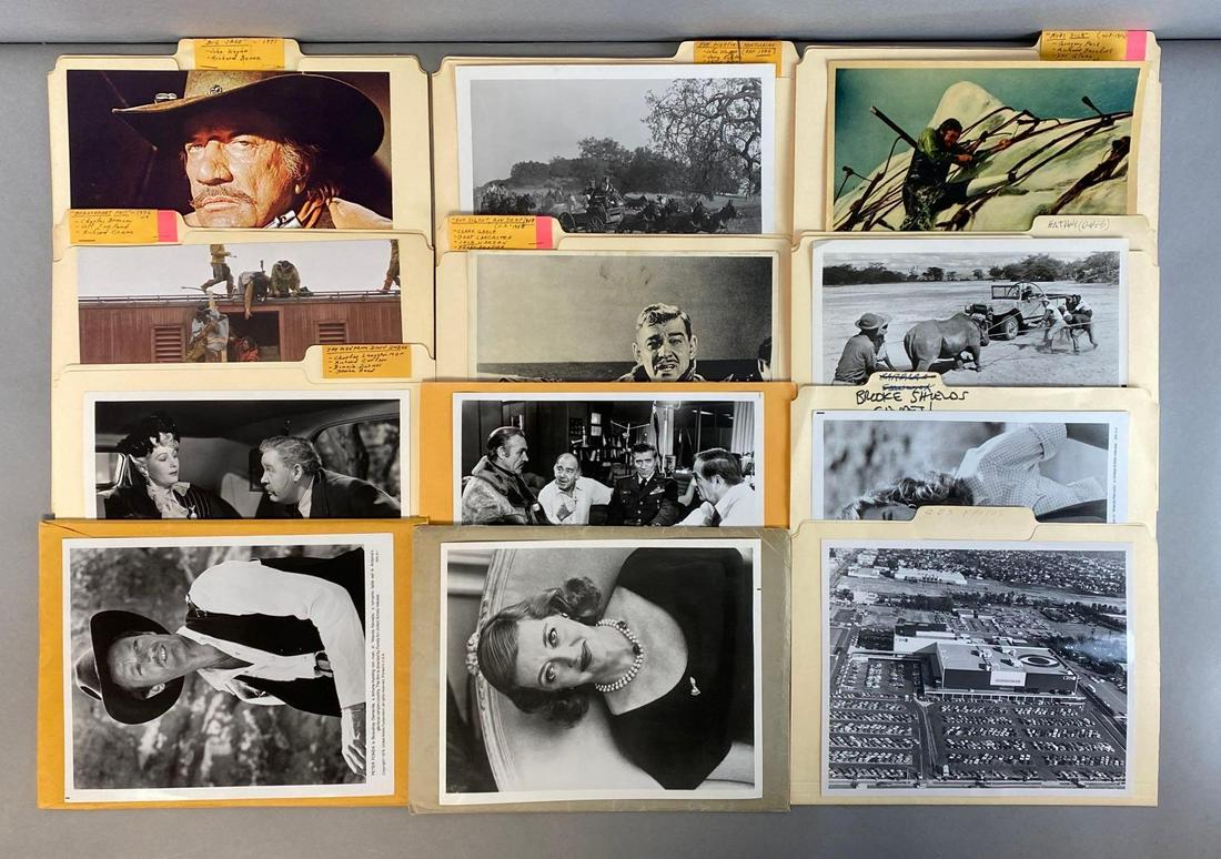 Group of Assorted Movie, Actors, and Location Lithograph Prints and More: Includes 12 envelopes/folders of assorted prints, Including The Man from Down Under, Breakheart Pass, Big Jake, Moby Dick, and more, All prints measure 8 x 10in.