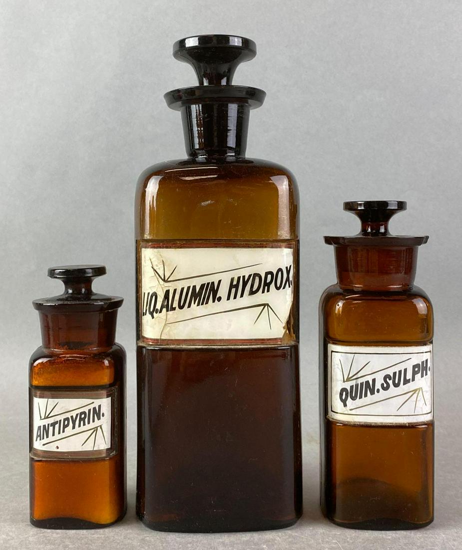 Group of 3 Amber Glass Apothecary Jars: chipped and cracked, glass labels - very fragile, largest is 9.75 inches tall
