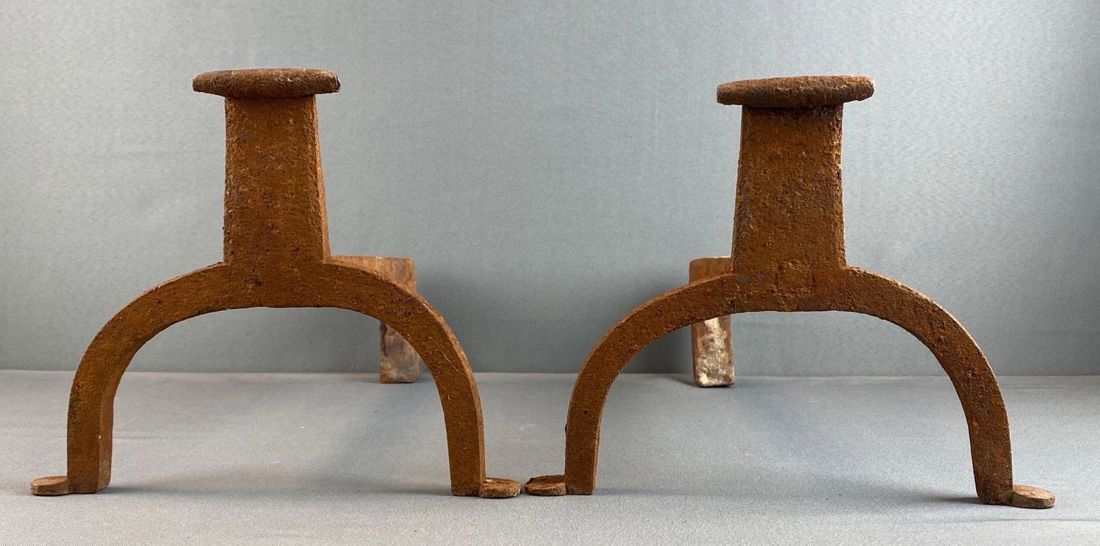 Pair of Cast IRon Fireplace Andirons: Heavily rusted, some pieces flaking, measures 9 1/4 x 11 3/4 x 18 1/2in each.