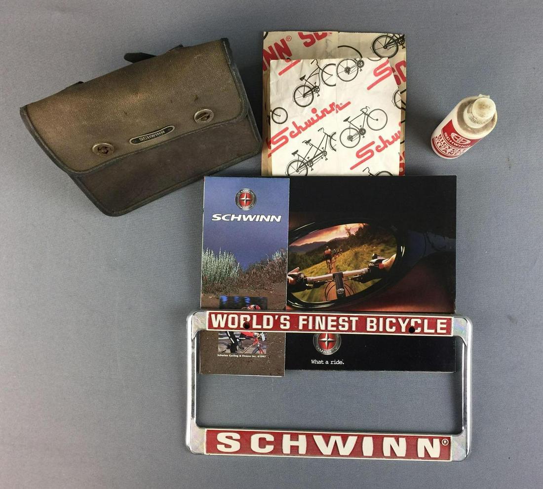 Group of Schwinn Bicycle Items: License plate holder, paper bags, cleaner, and more