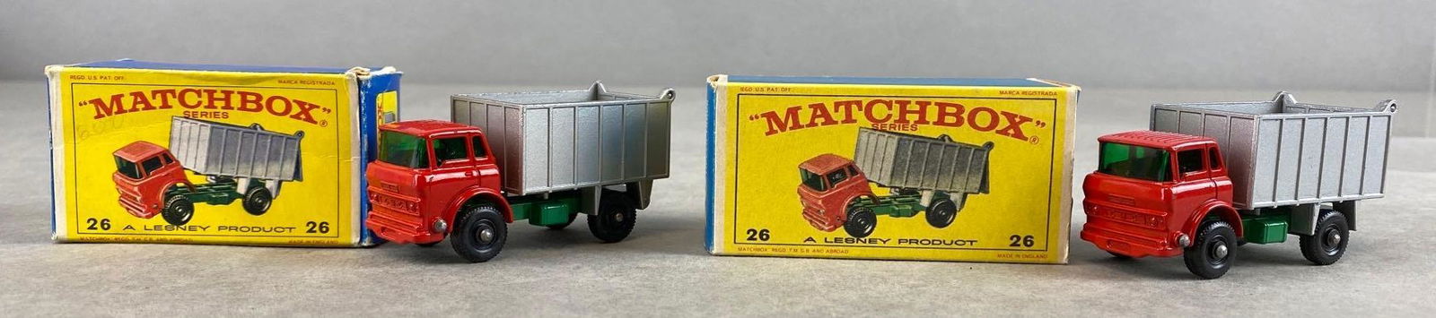Group of 2 Matchbox No. 26 G.M.C. Tipper Trucks: Red/Silver. A Lesney Product. BPW. Original Box. Made in England. Die-Cast.