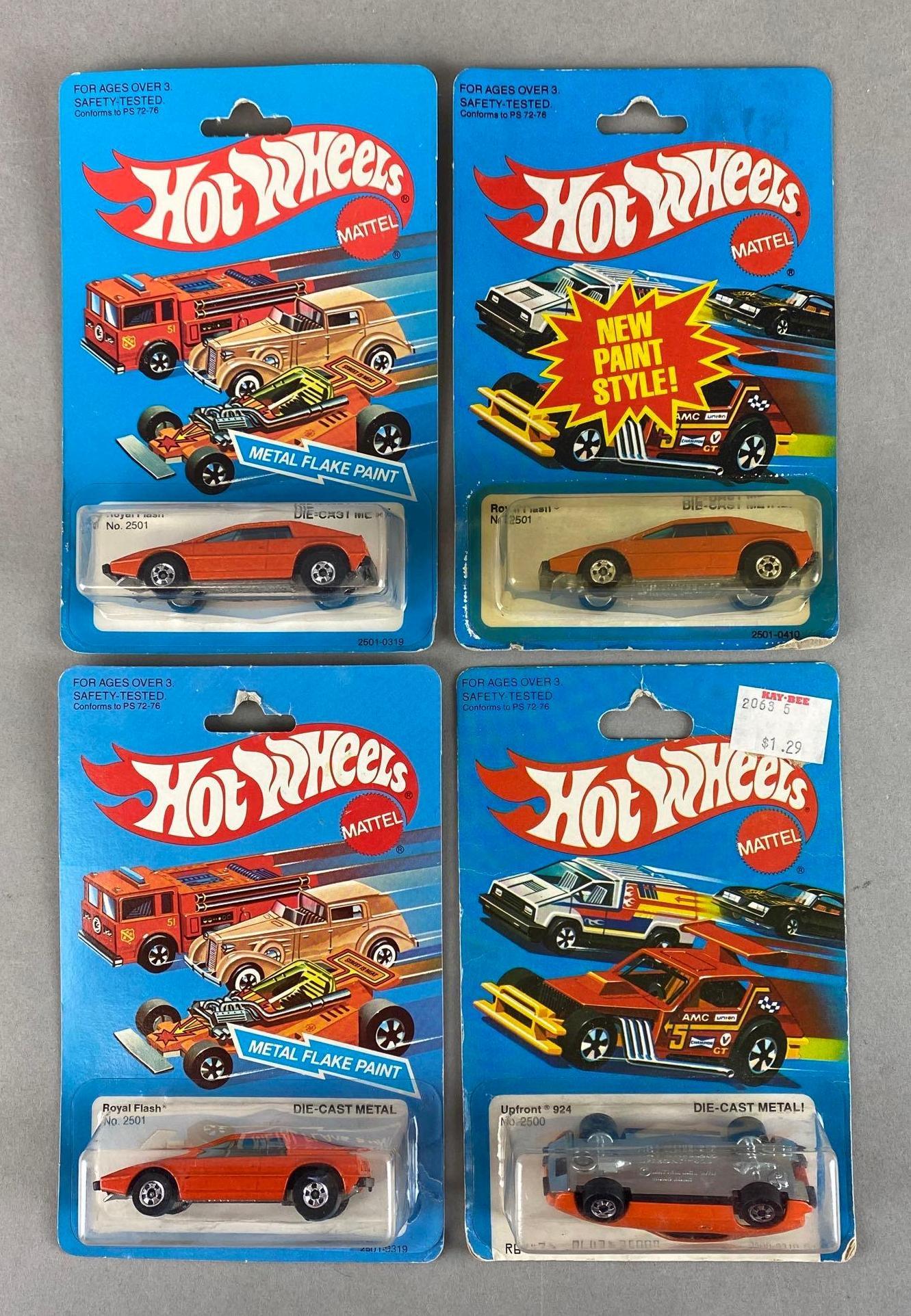 Group of 4 Hot Wheels Die-Cast Vehicles: Mattel. Includes No. 2501 Royal Flash, and No. 2500 Upfront 924. In original packaging 6 1/2 x 4 1/4 x 1 1/4in.