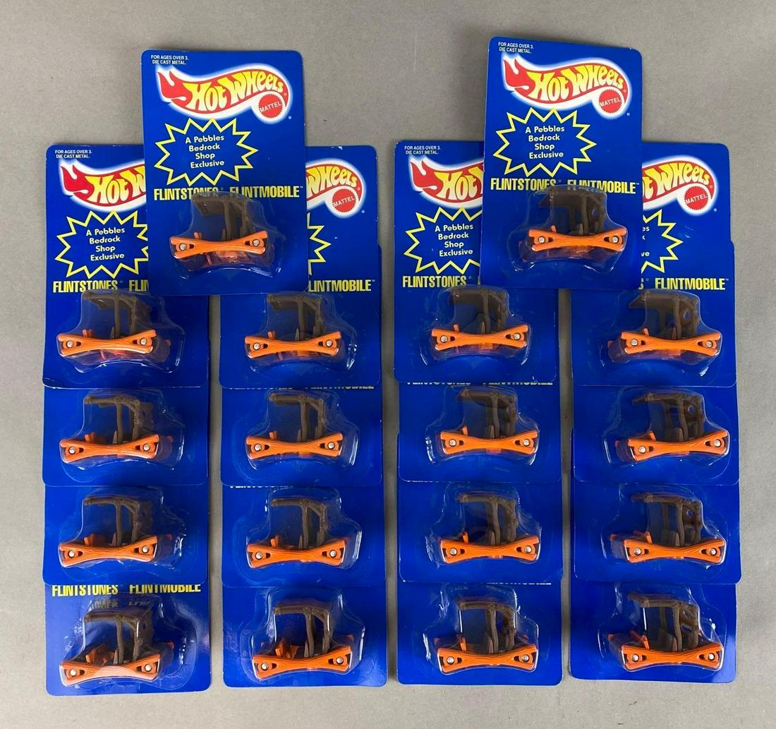 Group of 18 Hot Wheels Flintstones Flintmobiles: Mattel. Die-Cast. In original packaging. Packaging measures 6 1/2 x 4 1/4 x 1 1/4in.