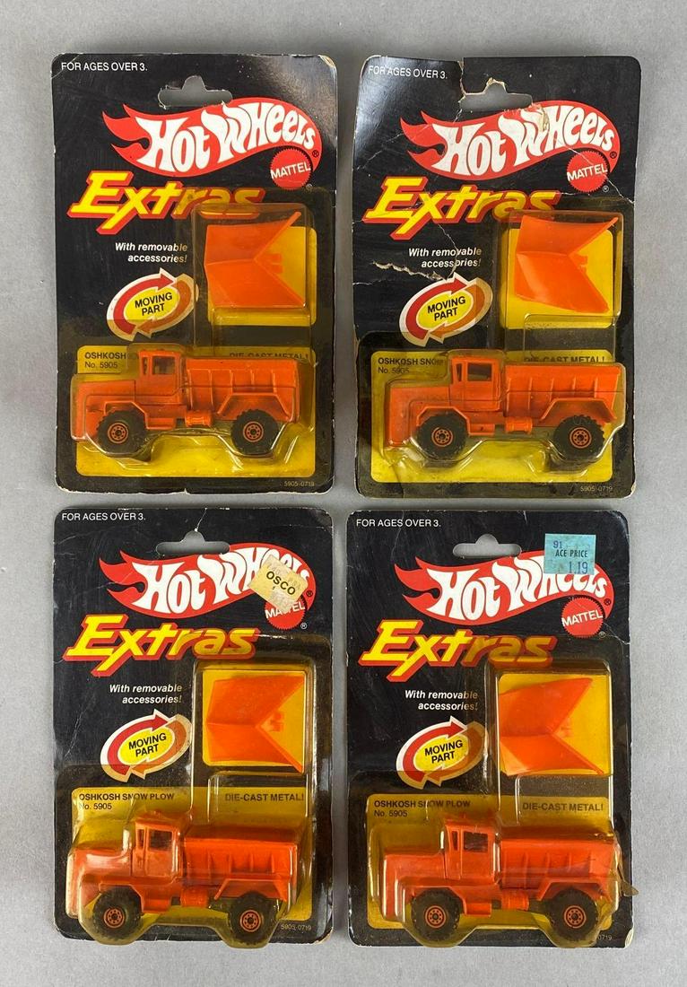 Group of 4 Hot Wheels Extras No. 5905 Oshkosh Snowplow: Mattel. In original packaging. Some tears in plastic. Packaging measures 6 1/2 x 4 1/4 x 1 1/2in.