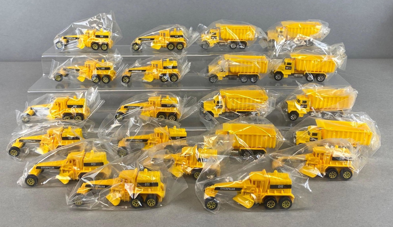 Group of 20+ Hot Wheels Die-Cast CAT Vehicles: 1979-91. Includes Tipper Trucks, and Street Cleaver.