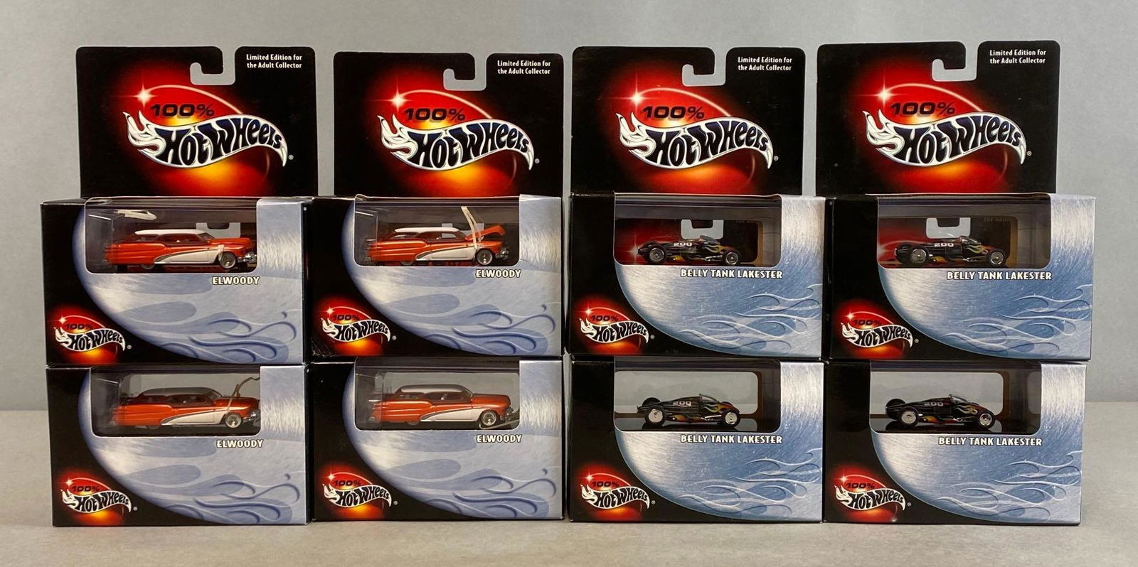 Group of 8 100 Percent Hot Wheels Die-Cast Vehicles: Mattel. 2000. Includes No. 3 Elwoody, and No. 10 Belly Tank Lakester. In original packaging. Packaging measures 7 x 5 1/2 x 2 3/4in.