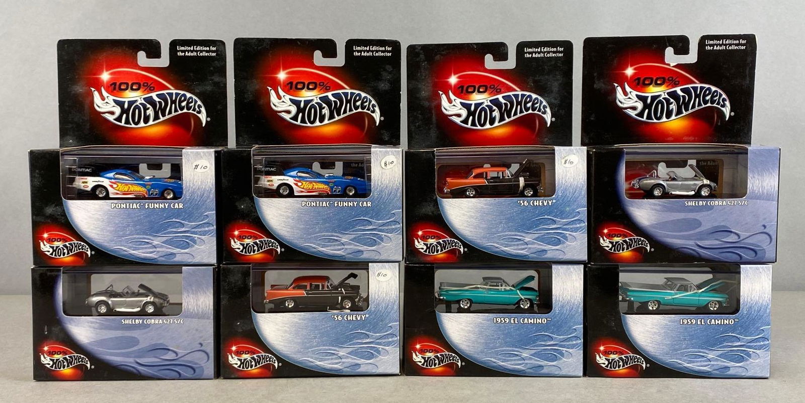 Group of 8 100 Percent Hot Wheels Die-Cast Vehicles: Mattel. 2000. Includes Pontiac Funny Car, Shelby Cobra 427 S/C, 1956 Chevy, and more. In original packaging. Packaging measures 7 x 5 1/2 x 2 1/2in.