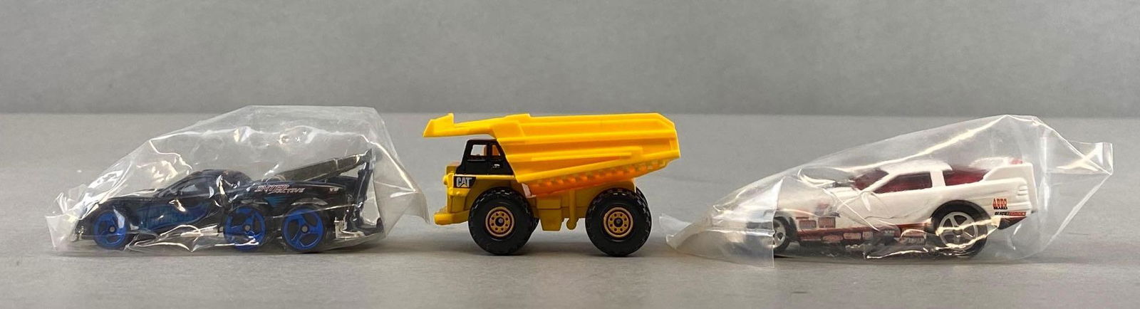 Group of 50+ Assorted Die-Cast Vehicles: includes matchbox quarry dump truck, hot wheels tow jam, and hot wheels interactive. Majority are sealed