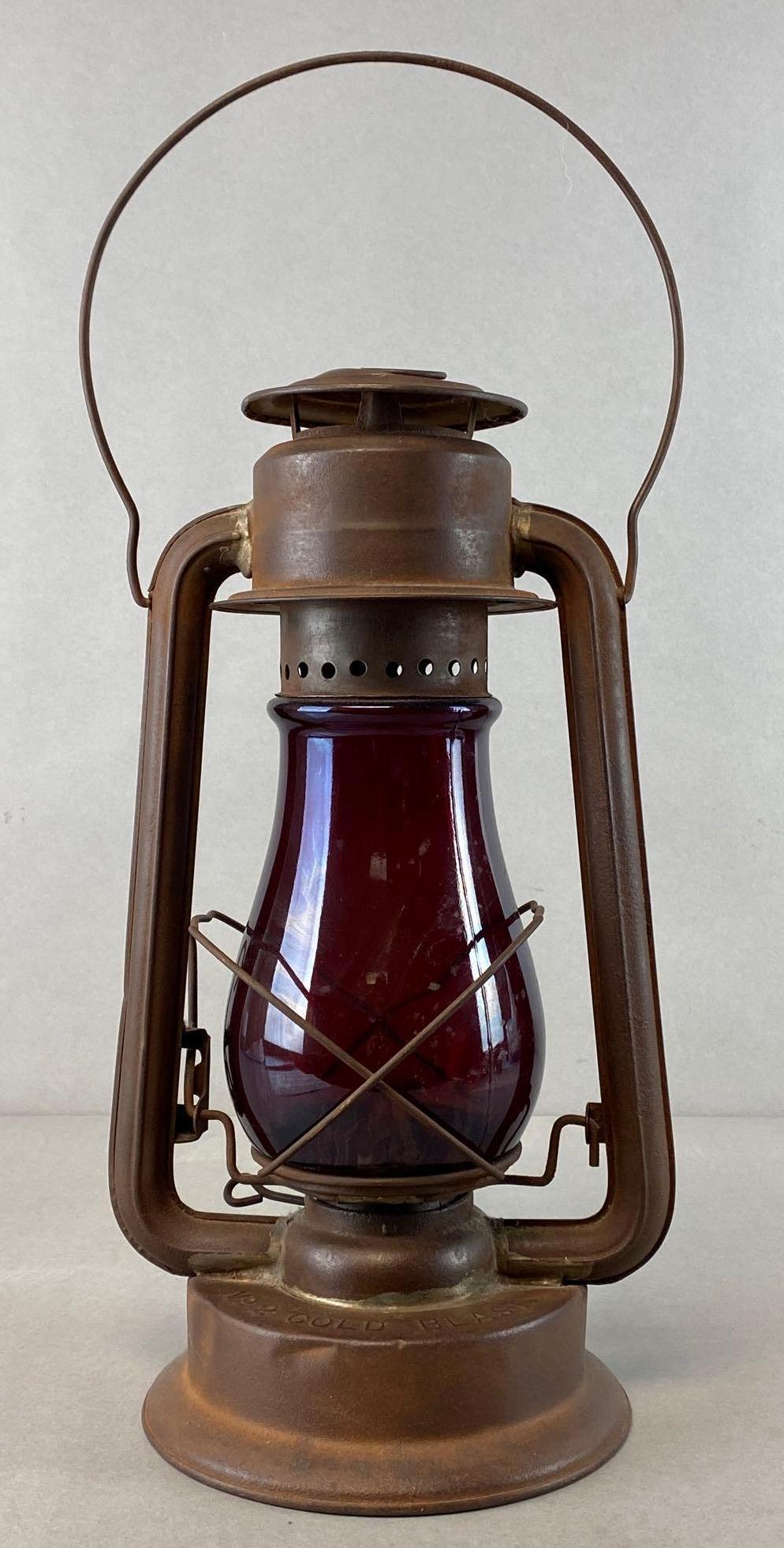Paulls Leader No. 2 Cold Blast Brass Oil Lantern: Ruby red glass shade, Untested, Measures 18 3/4 x 8 x 6 1/2in with handle up.