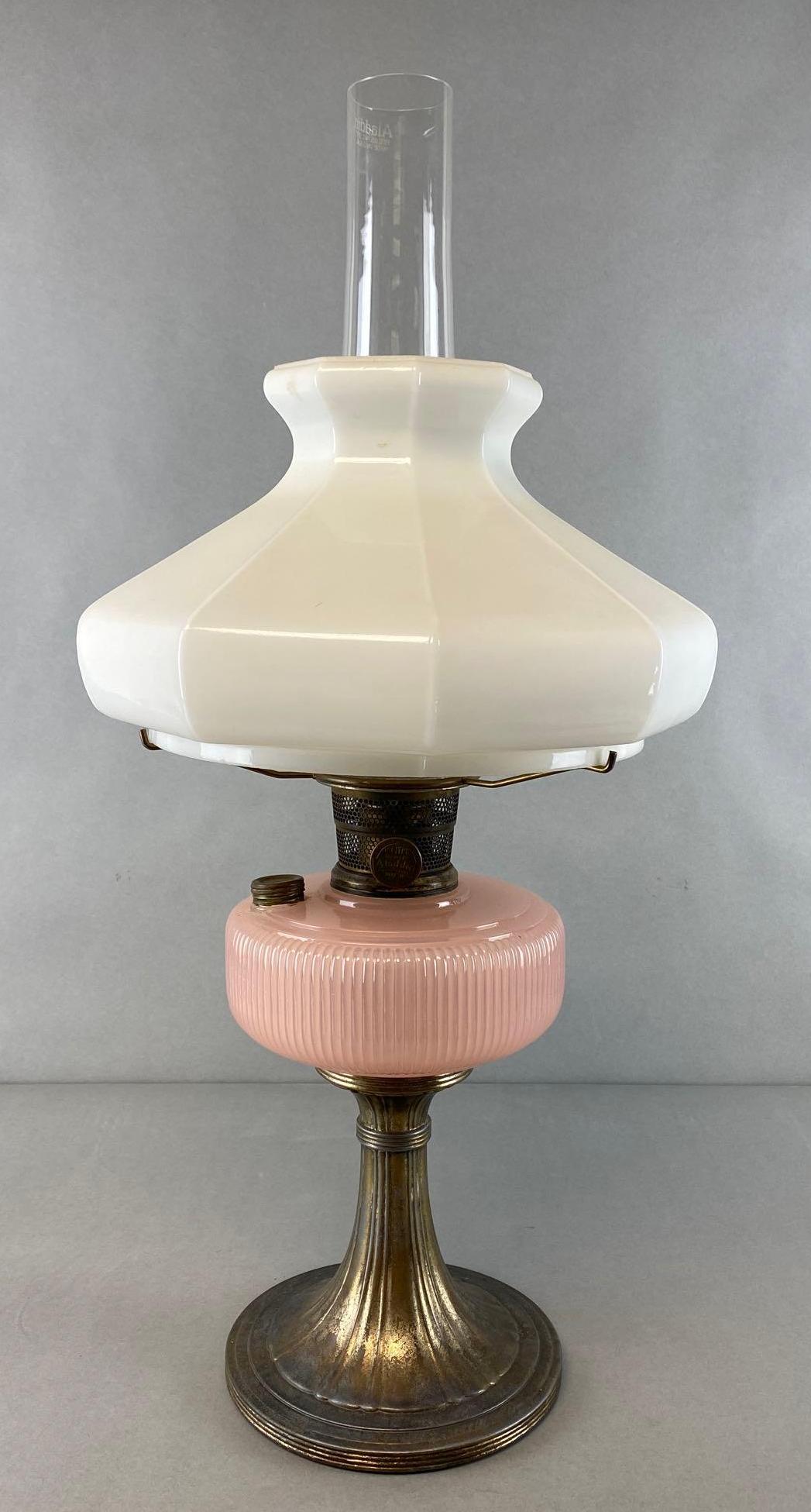 Aladdin Nu Type Model B Mantle Oil Lamp: Chicago Illinois, Milk Glass shade with pink glass base, Fitter measures 9in, Lamp measures 25 1/2 x 13 x 13in.