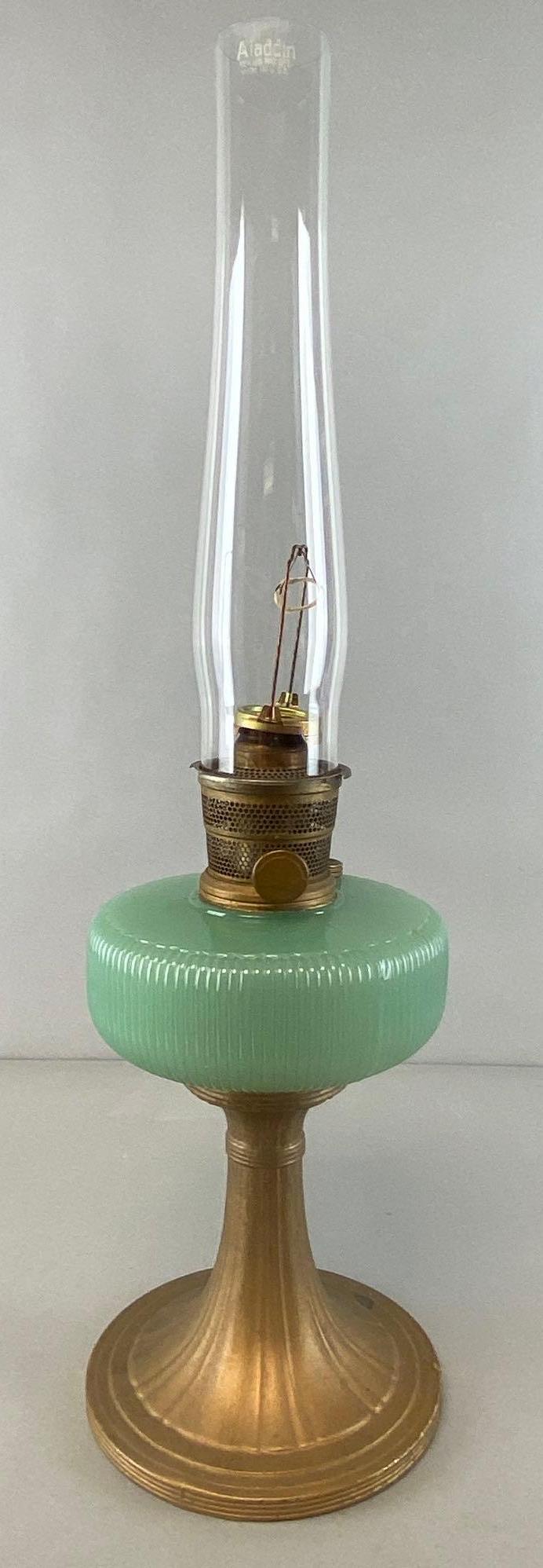 Aladdin Green Glass and Brass Oil Lamp: Measures 25 1/2 x 7 x 7in.
