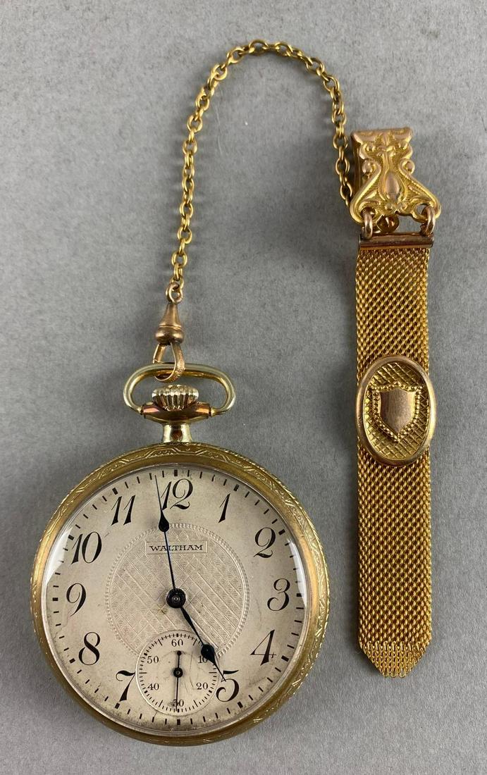 Waltham Railroad Open Faced Pocket Watch: With display case, Watch measures 2 1/2 x 2in, Chain with fob measures 7 1/2in.