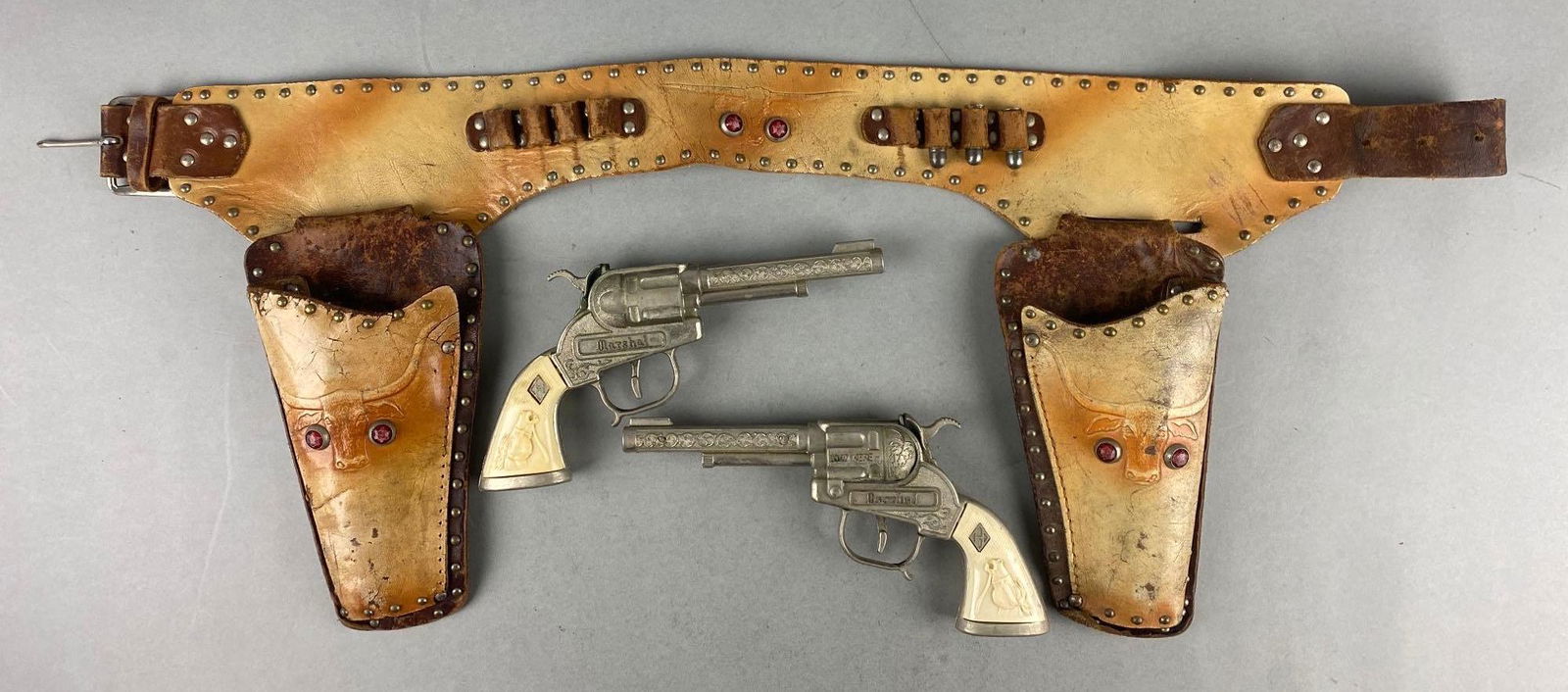 Marshall Halco Leslie Henry Die-Cast Cap Guns With Leather Holster: Cap guns in working condition. holster measures 24 inches long